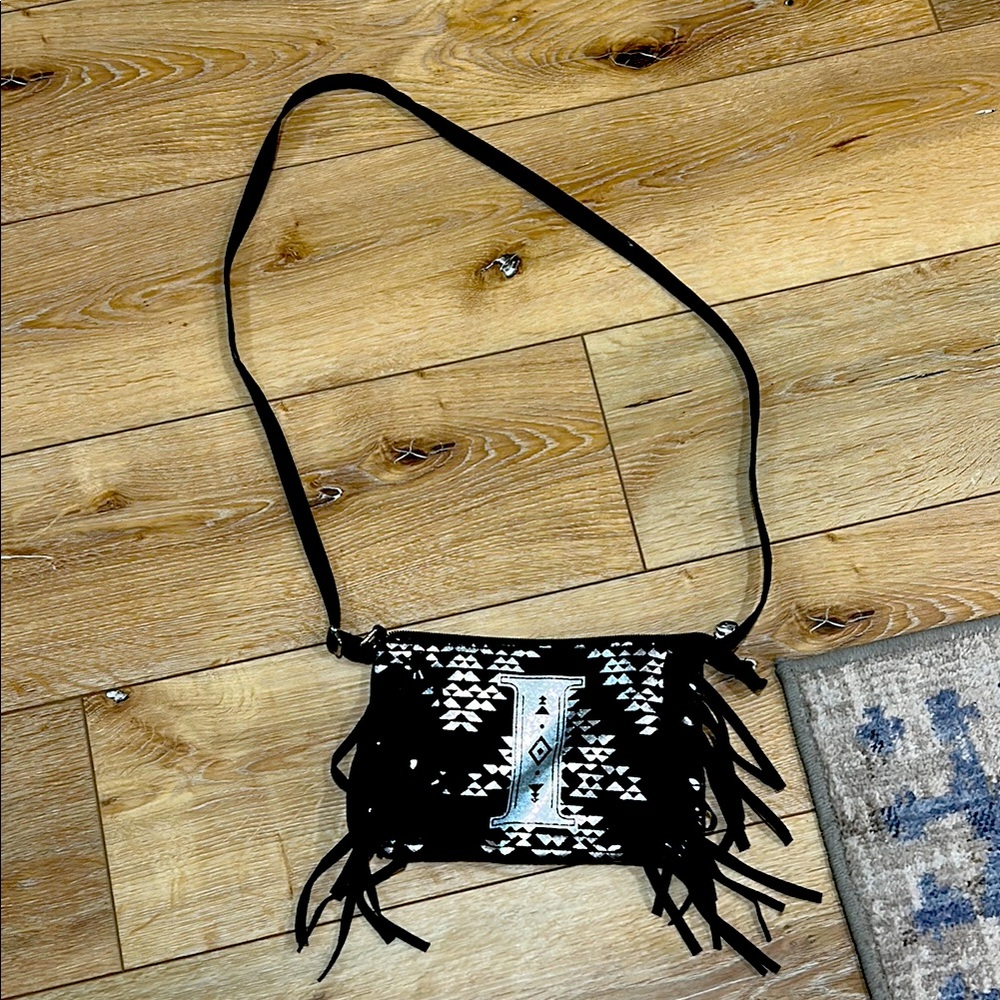 Black and Silver Fringe Justice Crossbody Initial (i) Bag.
